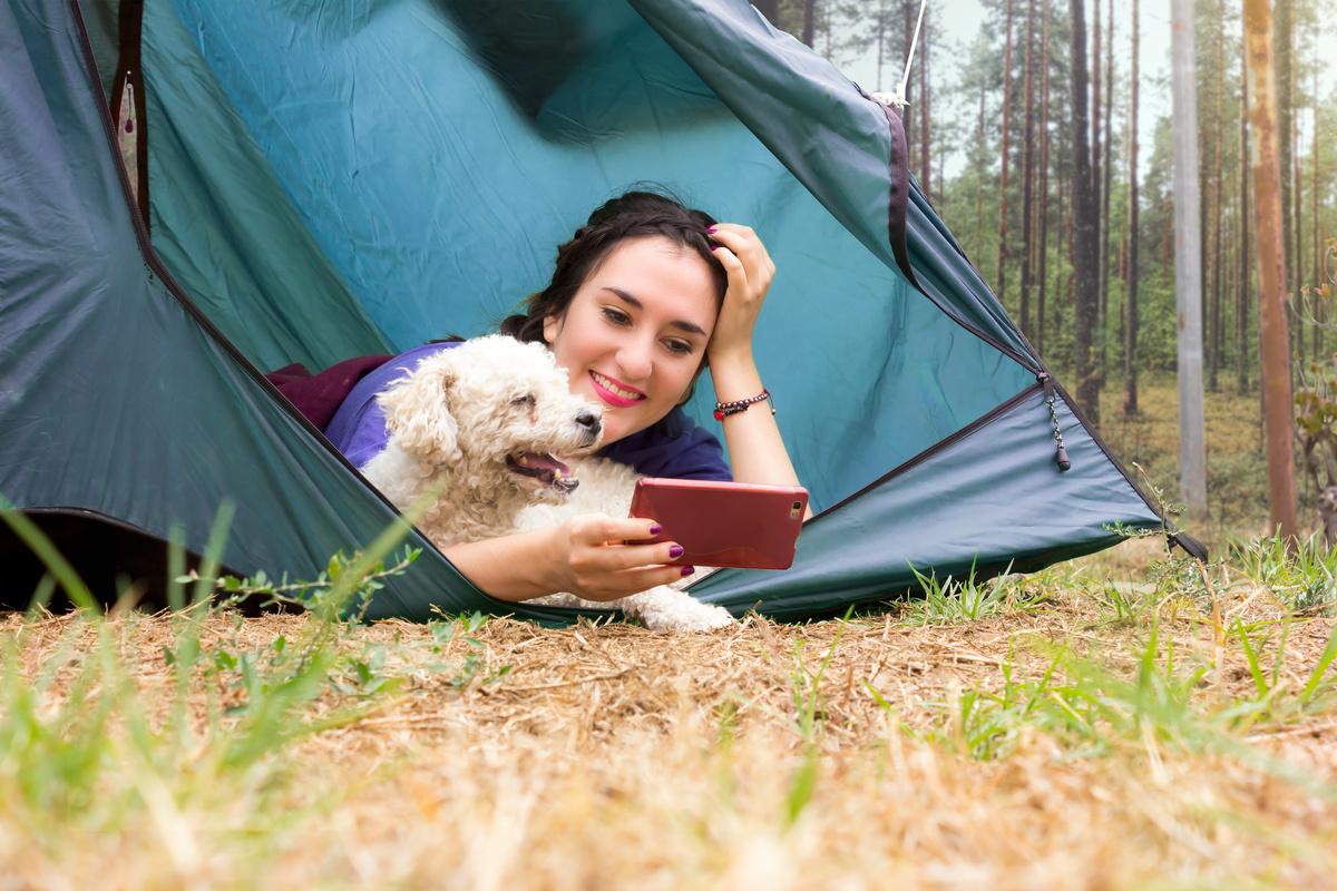 Woman and Pet Dog Camping
